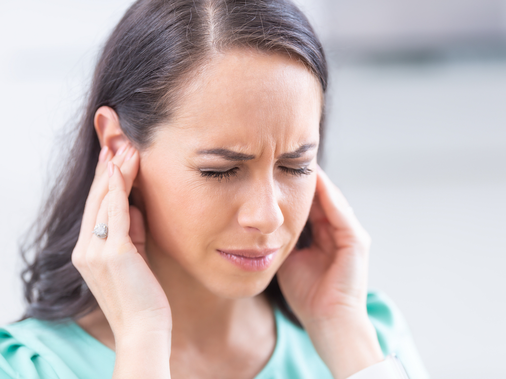 Doctor of Audiology evaluating a patient for tinnitus and ringing in the ears at AFA Balance & Hearing Institute in Mesa, AZ